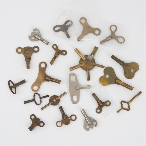 A collection of brass and nickel steel clock keys, including fusee ...