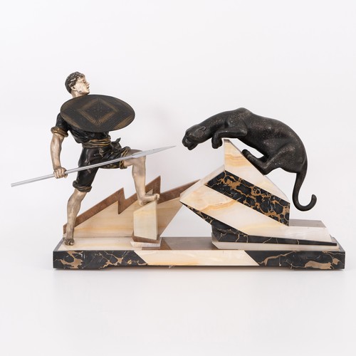 Art Deco 'The Hunter' spelter and leopard figural group, modelled as a man wearing enamel black and gold shirt and trousers, with knife in his waistband and holding a shield and chrome spear, mounted on a base of Portoro, brown marble and onyx, apparently unsigned, 17cm height, 14cm width, 63cm length.