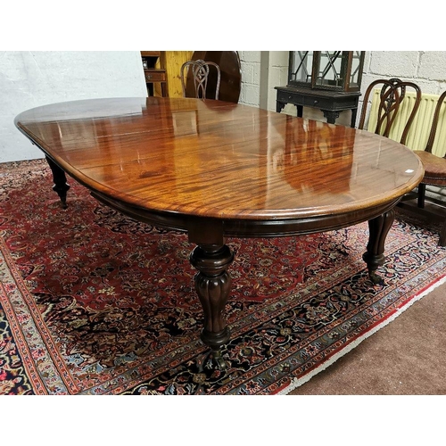 115 - A fine Victorian Mahogany Dining Room / Boardroom Table, with oval shaped ends, on turned and reeded... 