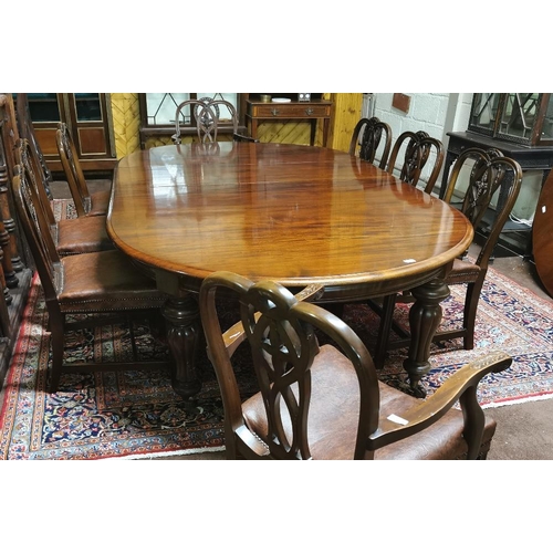 115 - A fine Victorian Mahogany Dining Room / Boardroom Table, with oval shaped ends, on turned and reeded... 