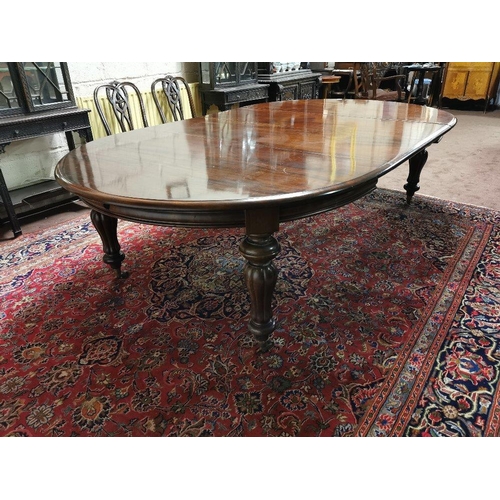 115 - A fine Victorian Mahogany Dining Room / Boardroom Table, with oval shaped ends, on turned and reeded... 