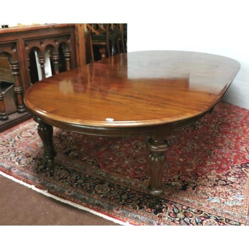 115 - A fine Victorian Mahogany Dining Room / Boardroom Table, with oval shaped ends, on turned and reeded... 