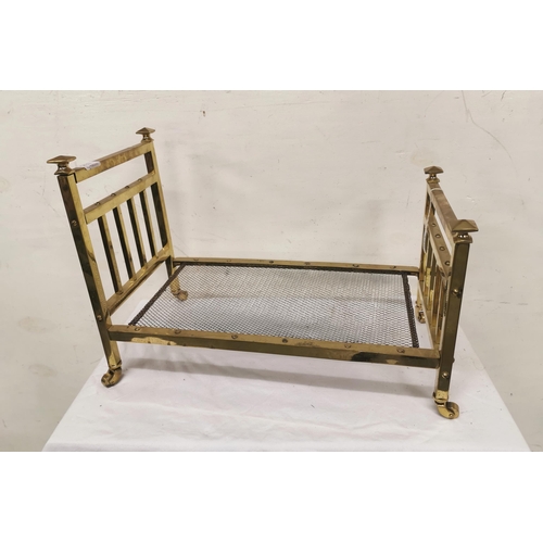 129 - Miniature brass bedstead, rail back with iron base, 37cmH x 52cmL