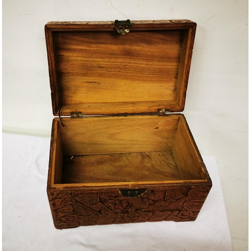 252 - Small oriental camphor wood box, carvings of figures in landscapes, hinged lid, 30cmW x 20cmH