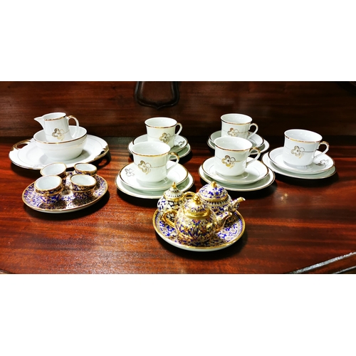 260 - Ornamental Childs Tea Set, blue and white flowers with gilt borders incl. 2 tea pots, 2 plates & a ... 