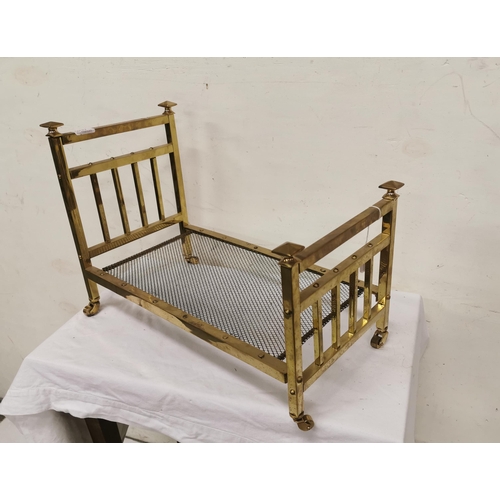 129 - Miniature brass bedstead, rail back with iron base, 37cmH x 52cmL