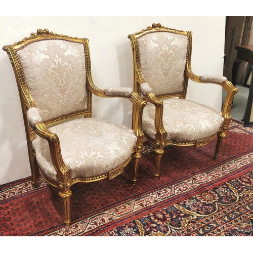 32 - Matching Pair of Carved Gilt Wood framed Armchairs, the backs and seats covered with silver hued fab... 