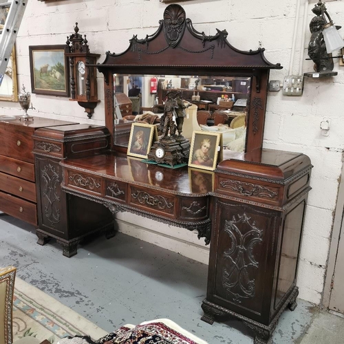 57 - Late 19thC Large Mahogany Sideboard, a shell shaped pediment to the mirrored back, over a pedestal b... 