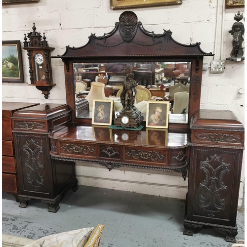 57 - Late 19thC Large Mahogany Sideboard, a shell shaped pediment to the mirrored back, over a pedestal b... 