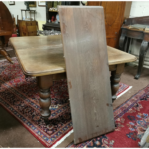 584 - Large Edw. Mahogany Dining Table (2 removable leaves), with curved ends, on large turned legs, casto... 