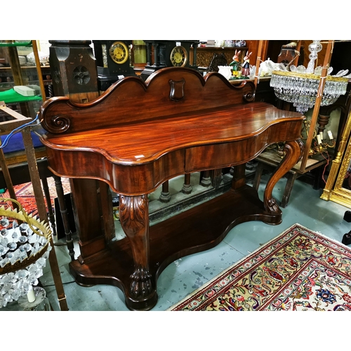 83 - 19thC Mahogany Serpentine Shaped Side Table with apron drawer and shaped gallery featuring an emblem... 