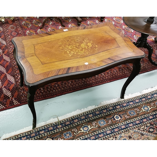 95 - Marquetry decorated French Low / Coffee Table, on cabriole legs with gilt mounts, shaped top and apr... 