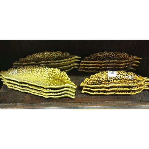 340 - 2 sets of brown glazed corn dishes, 16 approx.