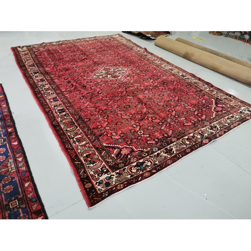 377 - Persian Hamaden Village Carpet, washed red ground, hand woven, all over design, 3.3m x 2.16m