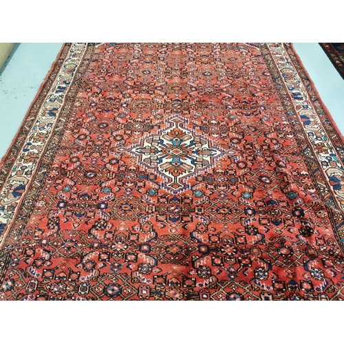 377 - Persian Hamaden Village Carpet, washed red ground, hand woven, all over design, 3.3m x 2.16m