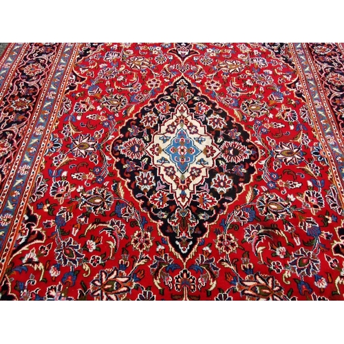 379 - Rich Red Ground Fine Woven Persian Kashan Carpet, traditional floral Kashan design, with tones of gr... 