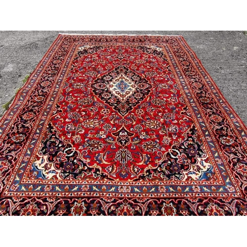 379 - Rich Red Ground Fine Woven Persian Kashan Carpet, traditional floral Kashan design, with tones of gr... 