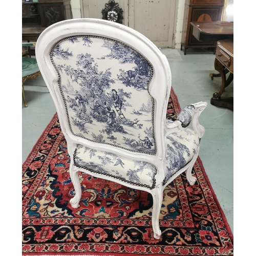 16 - Good Blue Toile Covered Armchair, studded borders, with a curved back, cream-painted frame, on cabri... 