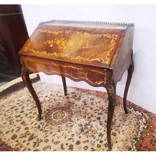 121 - 19thC French Walnut Bureau de Dame, marquetry inlaid, with a fitted interior and brass gallery, on c... 