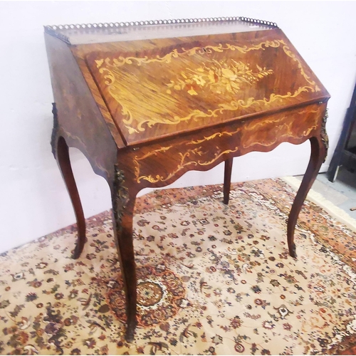 121 - 19thC French Walnut Bureau de Dame, marquetry inlaid, with a fitted interior and brass gallery, on c... 