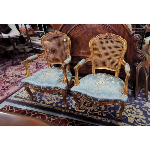 21 - Matching Pair of Bergere Back Armchairs, the seat and loose cushions covered with blue sateen floral... 