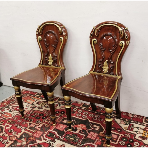 25 - Matching Pair of Antique Mahogany Hall Chairs, the curved backs featuring raised acanthus mouldings,... 