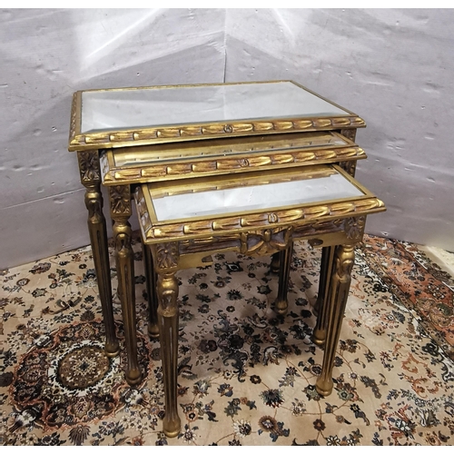 53 - Nest of 3 mirrored top graduating tables, painted gold (widest 62cmW)