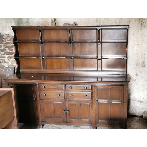 59 - Ercol Dresser, large sized, an open style top over 4 drawers and 4 cupboards, 2.15mW x 0.6D x 1.8mH