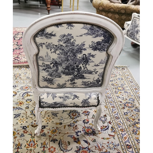 6 - Good Blue Toile Covered Armchair, studded borders, with a curved back, cream-painted frame, on cabri... 