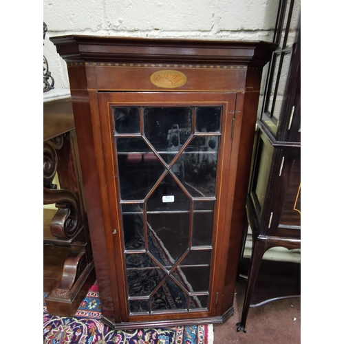 92 - Early 20thC Inlaid Mahogany wall hanging Corner Cabinet, an astragal glazed single door enclosing 3 ... 