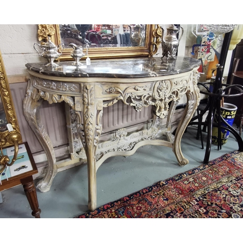 93 - Ornately Carved Consol Table with pierced floral fretwork, light cream coloured, with a serpentine s... 