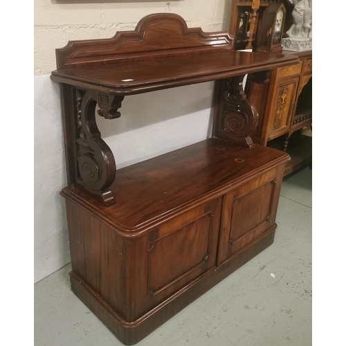 97 - A Victorian Mahogany Dumbwaiter, a shaped upper gallery above a serving shelf and a lower two-door c... 