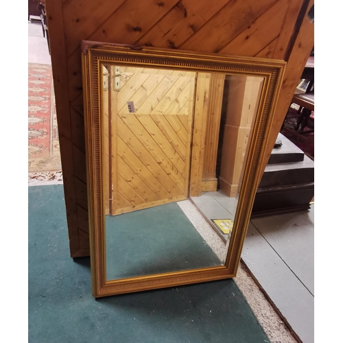 635 - A modern timber gilt Wall Mirror (damage to one corner of the frame), 72 x 102cm