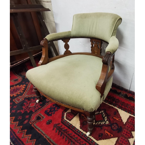 11 - Edw. Rosewood inlaid Sitting Room Armchair, on turned front legs, porcelain castors, green velour he... 