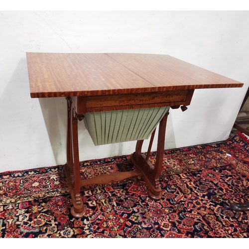 112 - WMIV Satinwood Games Table, with a fold-over desk top over a drawer with sewing compartments (& mate... 