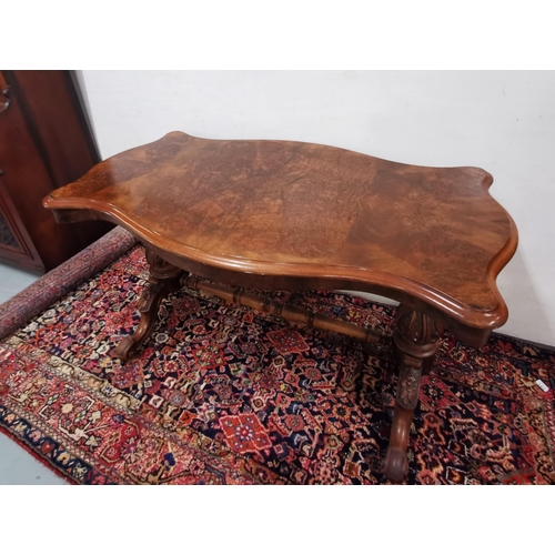 113 - Victorian Walnut Centre Table, the serpentine shaped top over a turned stretcher and four cabriole l... 