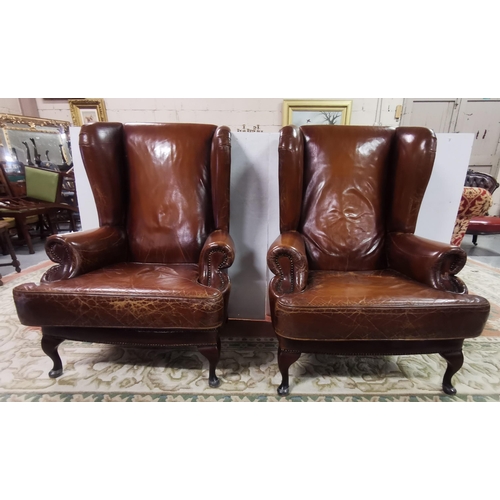 15 - Matching Pair of large Brown Leather High-back Armchairs, with similarly covered cushion seats, on Q... 