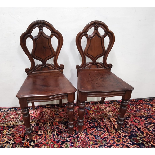 16 - Matching Pair of Victorian Mahogany Hall Chairs, with shield shaped backs, on turned front legs