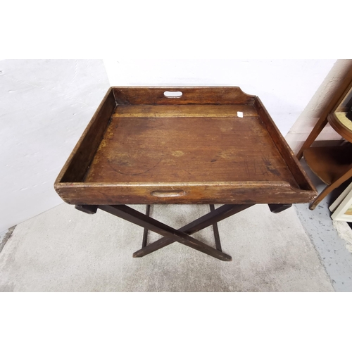 162 - Antique Mahogany Butlers Tray (64cmW), on a folding stand (tray repaired with an oak plank)