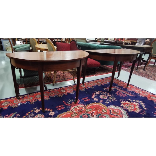 163 - Matching Pair of demi-lune Mahogany Side Tables, on tapered legs, cup castors, varnished, 1.24mW x 6... 