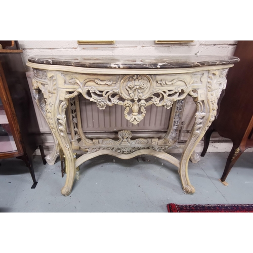 178 - Ornately Carved Consol Table with pierced floral fretwork, light cream coloured, with a serpentine s... 