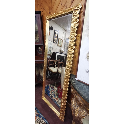 203 - Tall (& narrow) Rectangular Wall Mirror, all borders decorated with a broadleaf pattern, bevelled gl... 