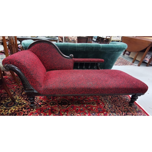 25 - Victorian walnut framed Chaise Longe , scrolled back, on turned legs, red fabric, 185cmW