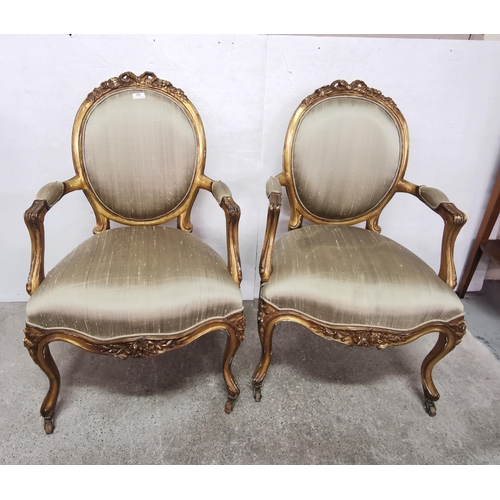 26 - Matching Pair of French Salon Armchairs, the ribbon shaped pediments over oval shaped green silk bac... 