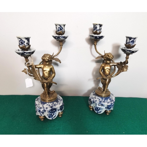 318 - Matching Pair of Bronzed Cherub Candelabra, 2 arms, on a blue and white porcelain base, brass feet, ... 