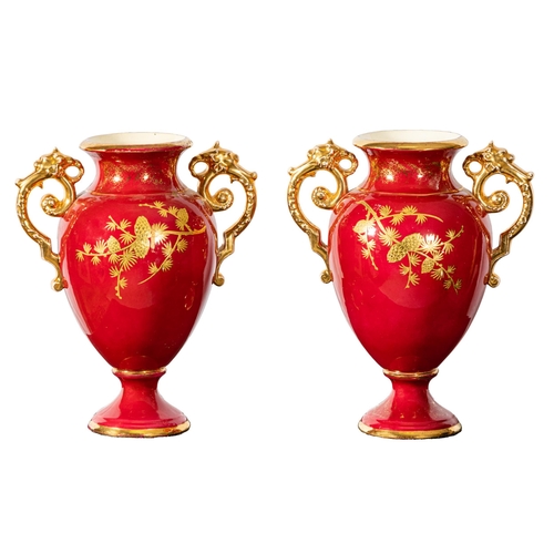 319 - Matching Pair of red ground porcelain Flower Vases, with gold handles and floral detail, 31cmH