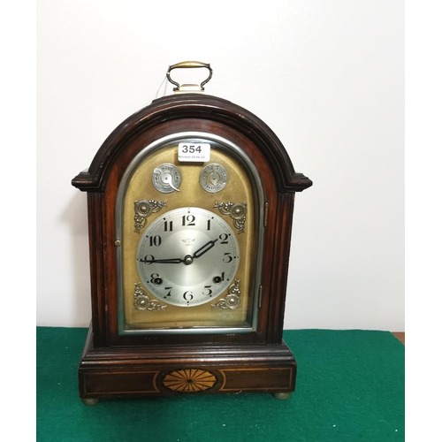 354 - Double Striking Mantle Clock, in a good mahogany case, the dial stamped Yiweco, on brass toes, brass... 