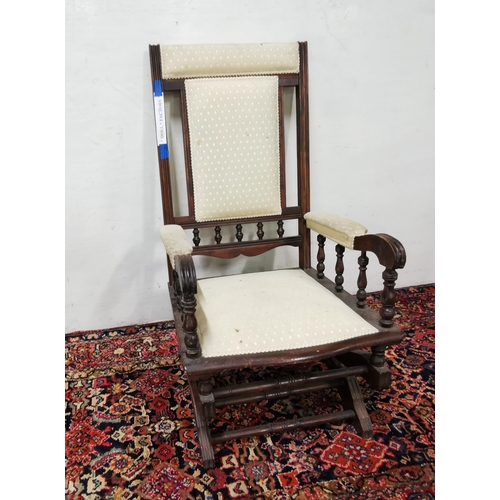 39 - Walnut framed Rocking Chair, cream padded headrest, back and seat