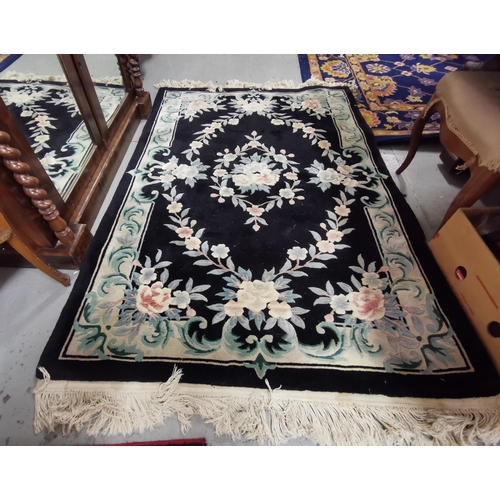 401 - Chinese wool Floor Rug, black ground with pink and blue flowers, 1.85cmL x 1.22cmW