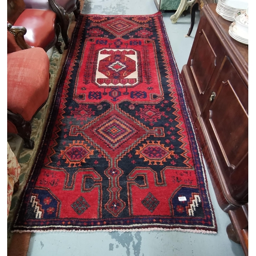 402 - Handwoven Persian Nahvan Village Rug, unique medallion design piece, red ground, signed 2.53 x 1m